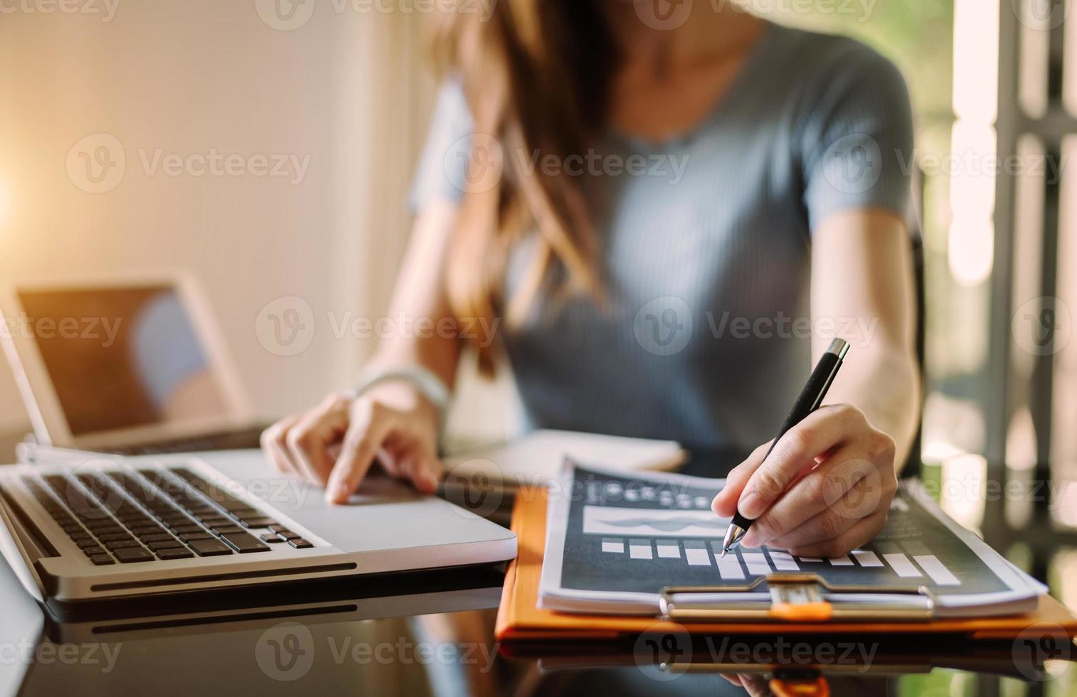 businessman hand working with new modern computer and writing on the notepad strategy diagram as concept photo