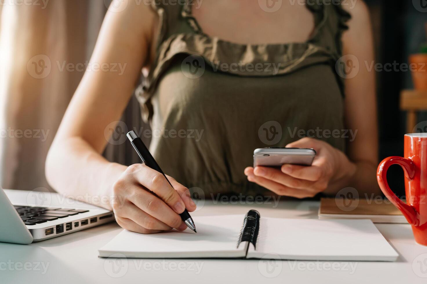 businessman hand working with new modern computer and writing on the notepad strategy diagram as concept morning light photo