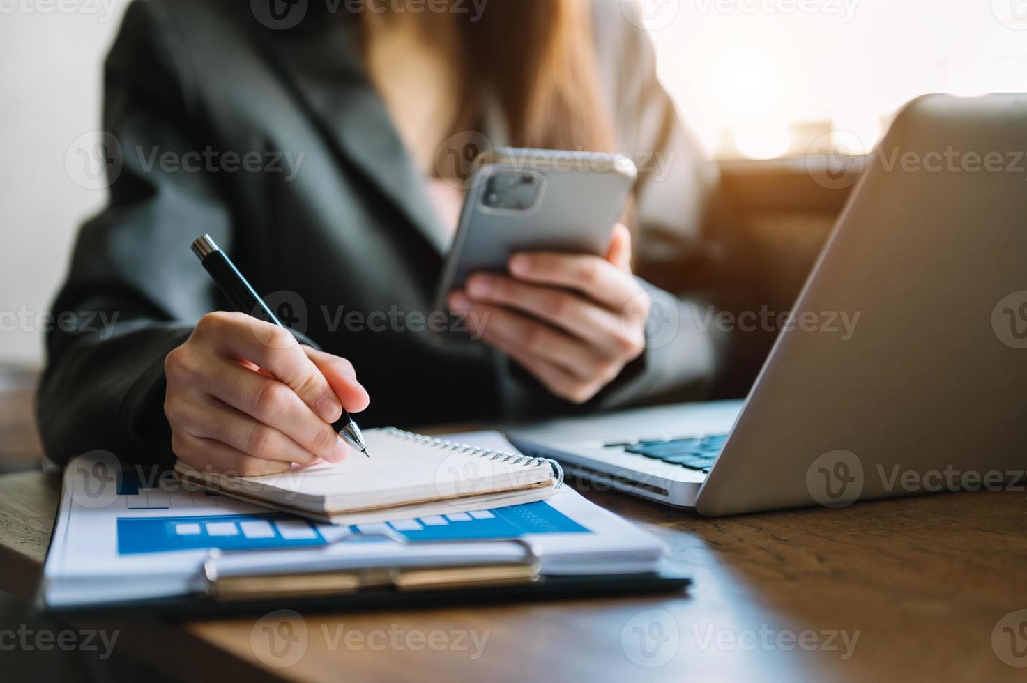 businessman hand working with new modern computer and writing on the notepad strategy diagram as concept photo