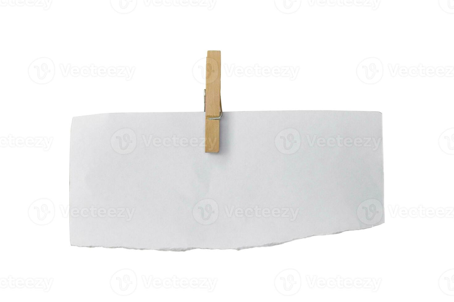 Wooden clip and white paper torn isolated on white background. Object with clipping path photo