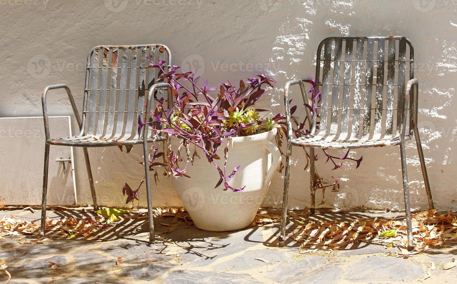 Two old metal, vintage garden chair and vase 6275149 Stock Photo at