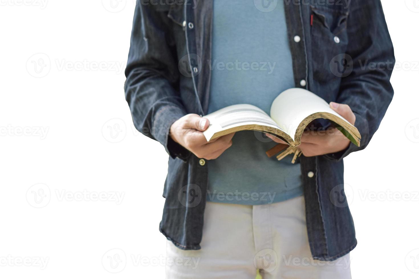 Picture of young man isolated on white background holding book reading. photo