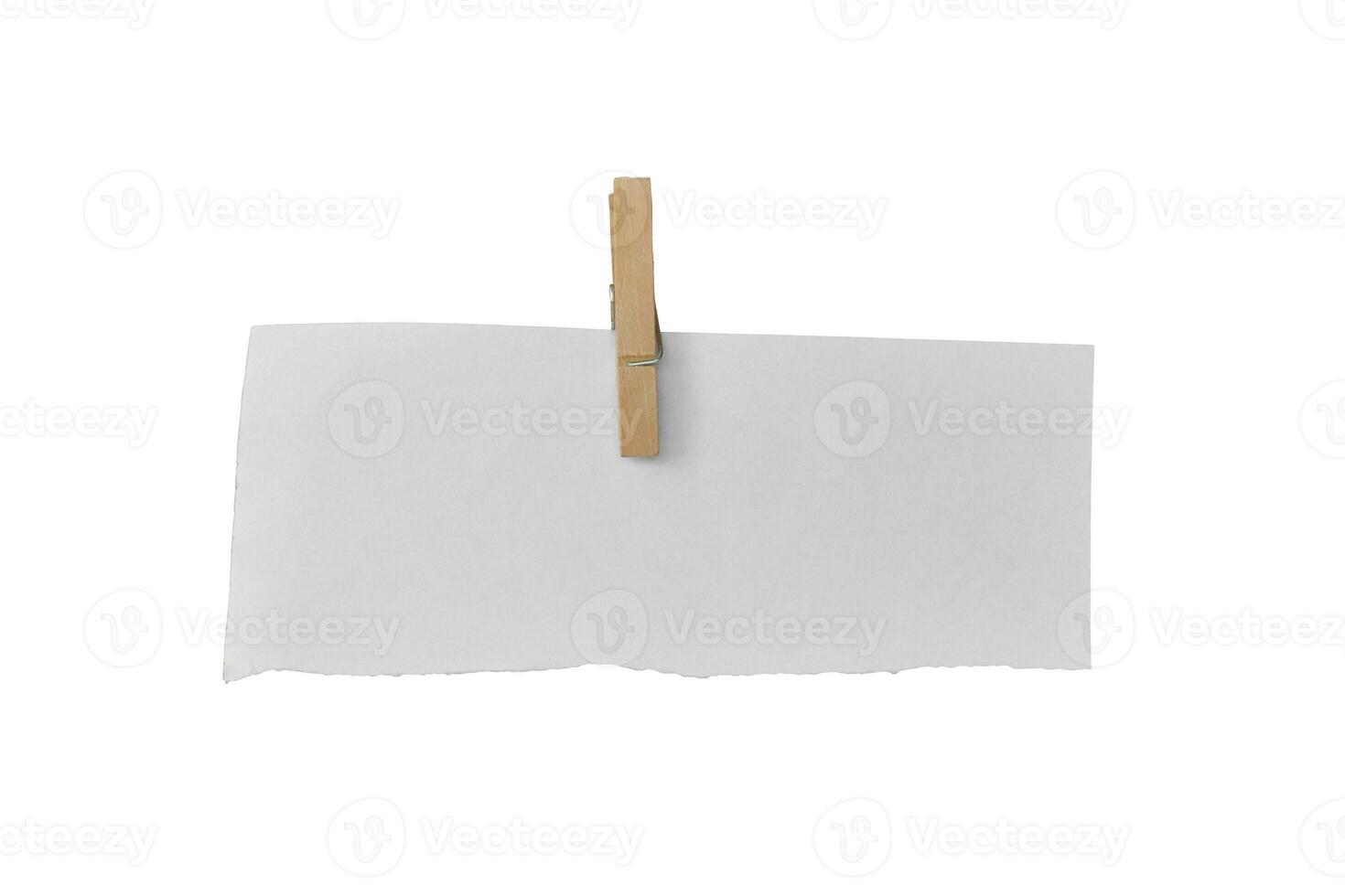 Wooden clip and white paper torn isolated on white background. Object with clipping path photo