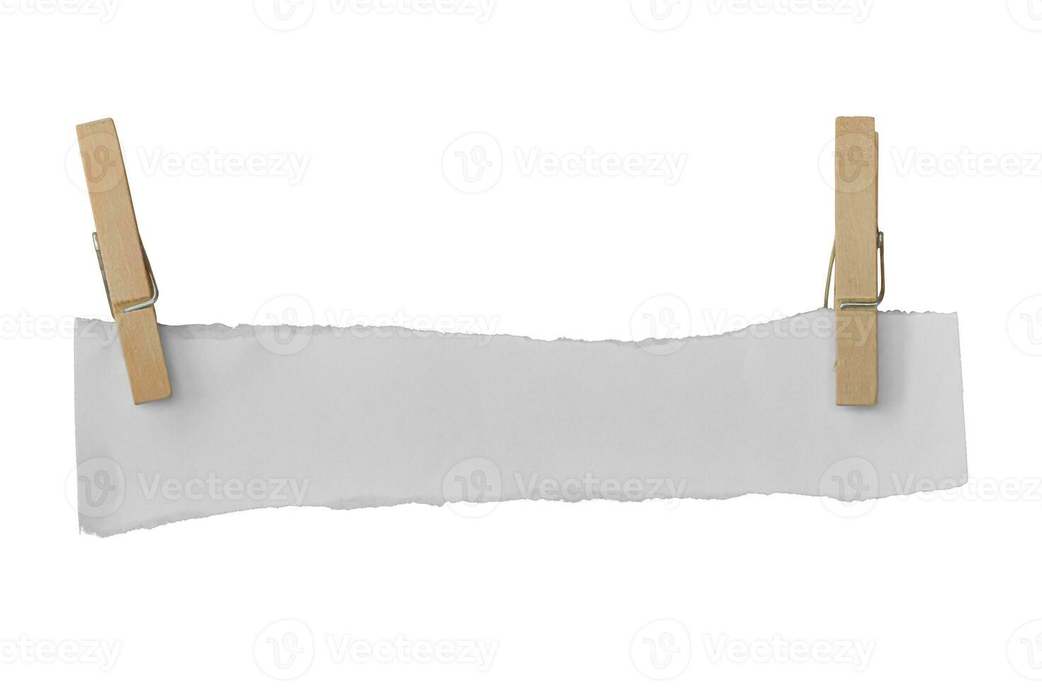 Wooden clip and white paper torn isolated on white background. Object with clipping path photo