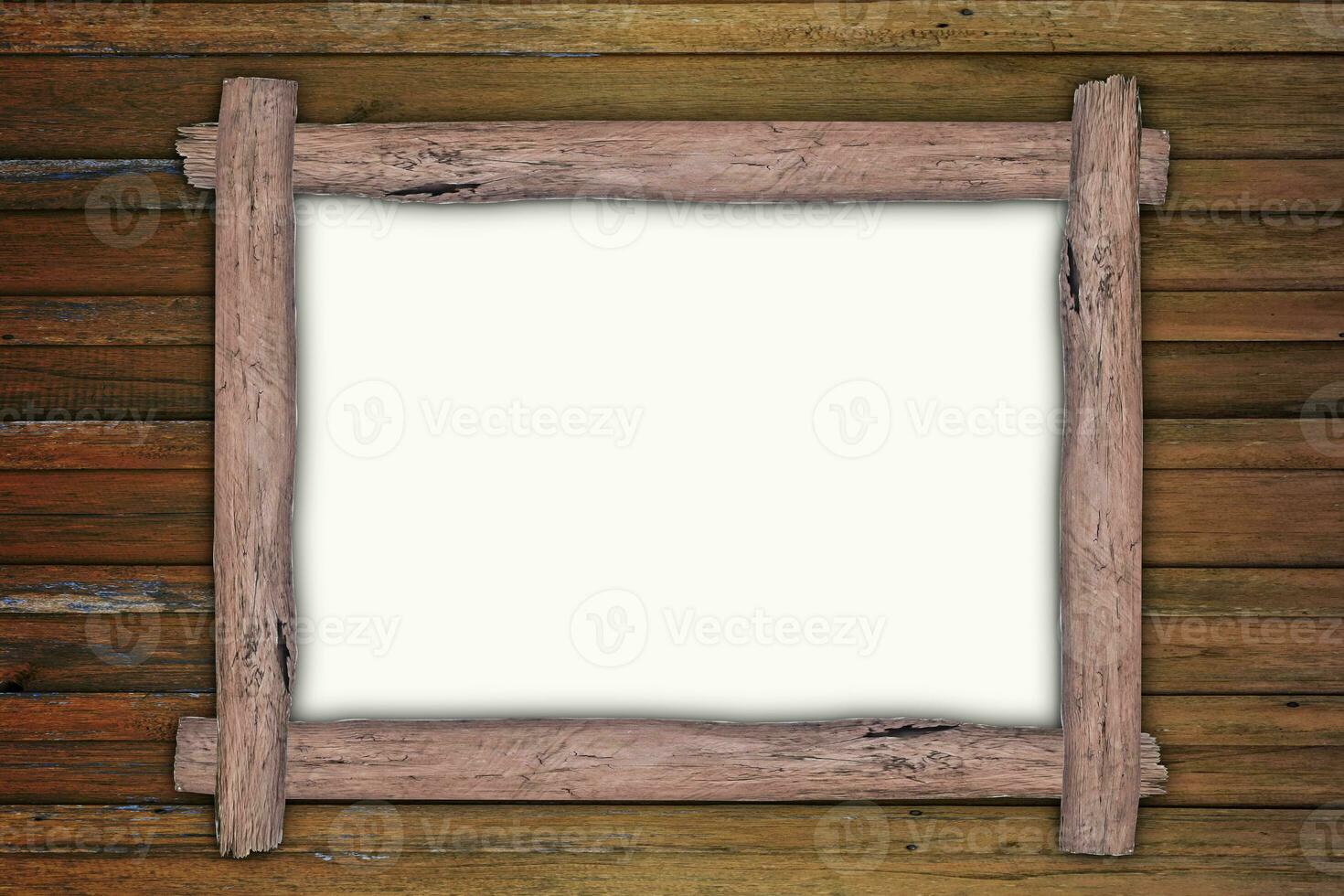 Empty wooden frame, hanging on wood panels background. Retro style design photo