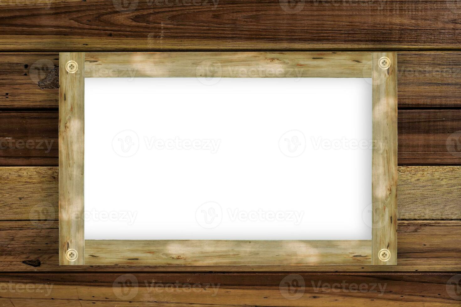 Empty wooden frame, hanging on wood panels background. Retro style design photo