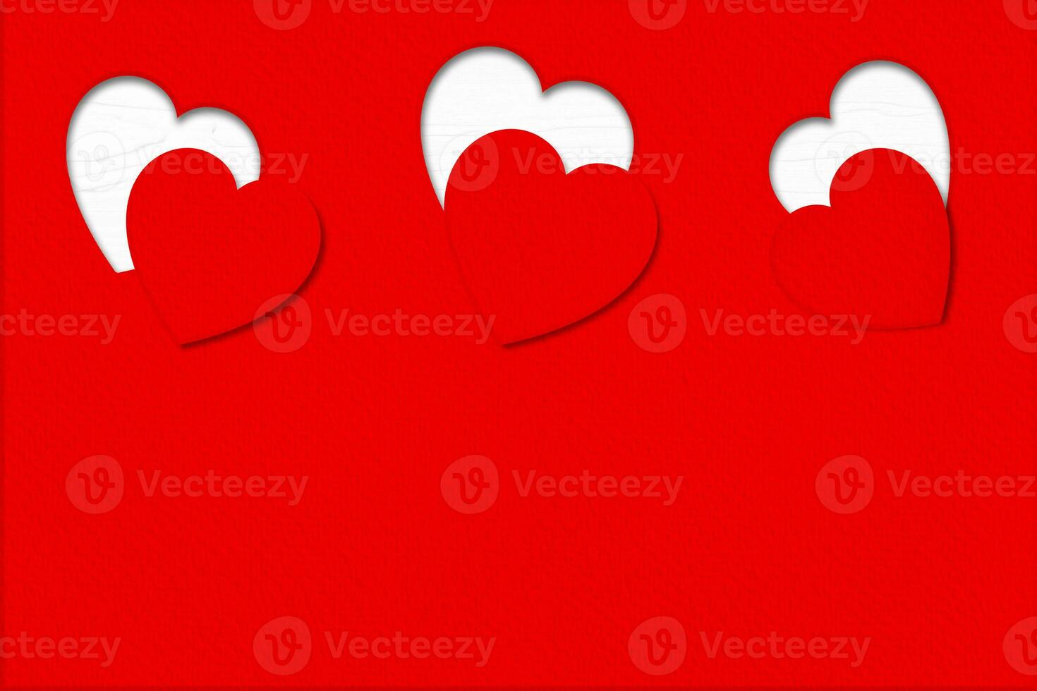 Heart carved on red paper background. Design for Valentine day concepts. photo