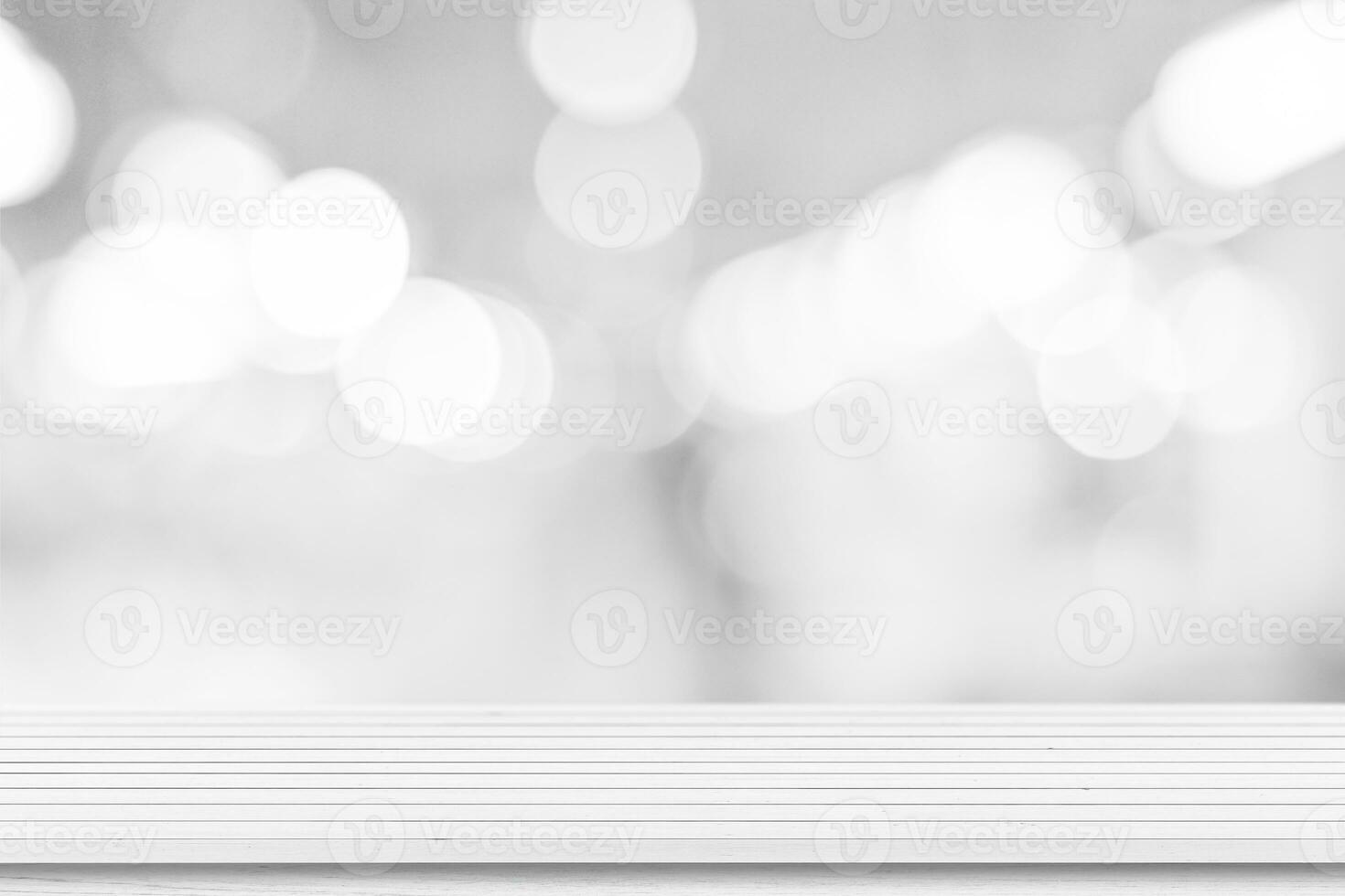 White wooden table top background over blur bokeh light, For product display or montage. photo