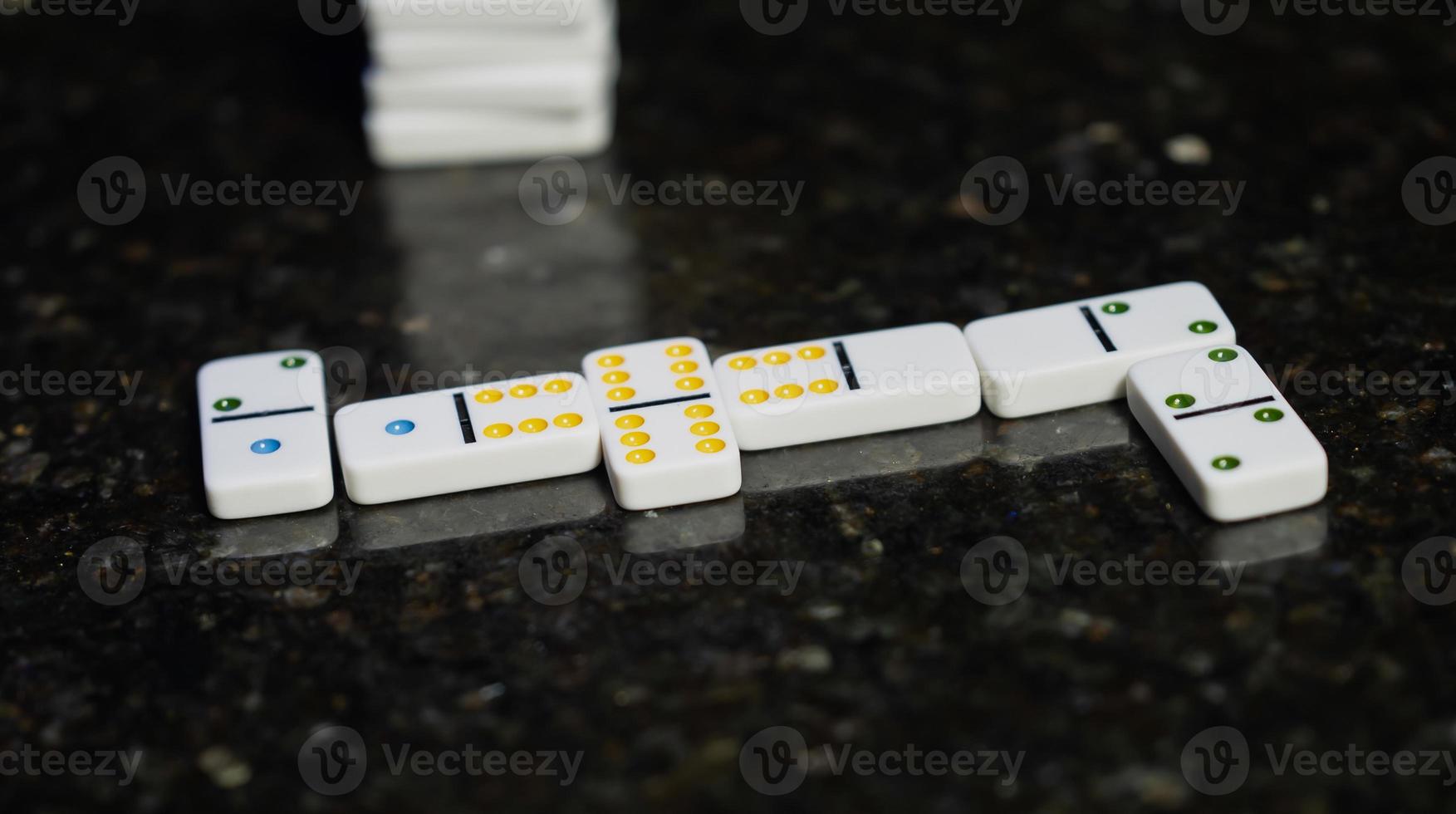 Board game of dominoes. Domino bones laid out on the table. photo
