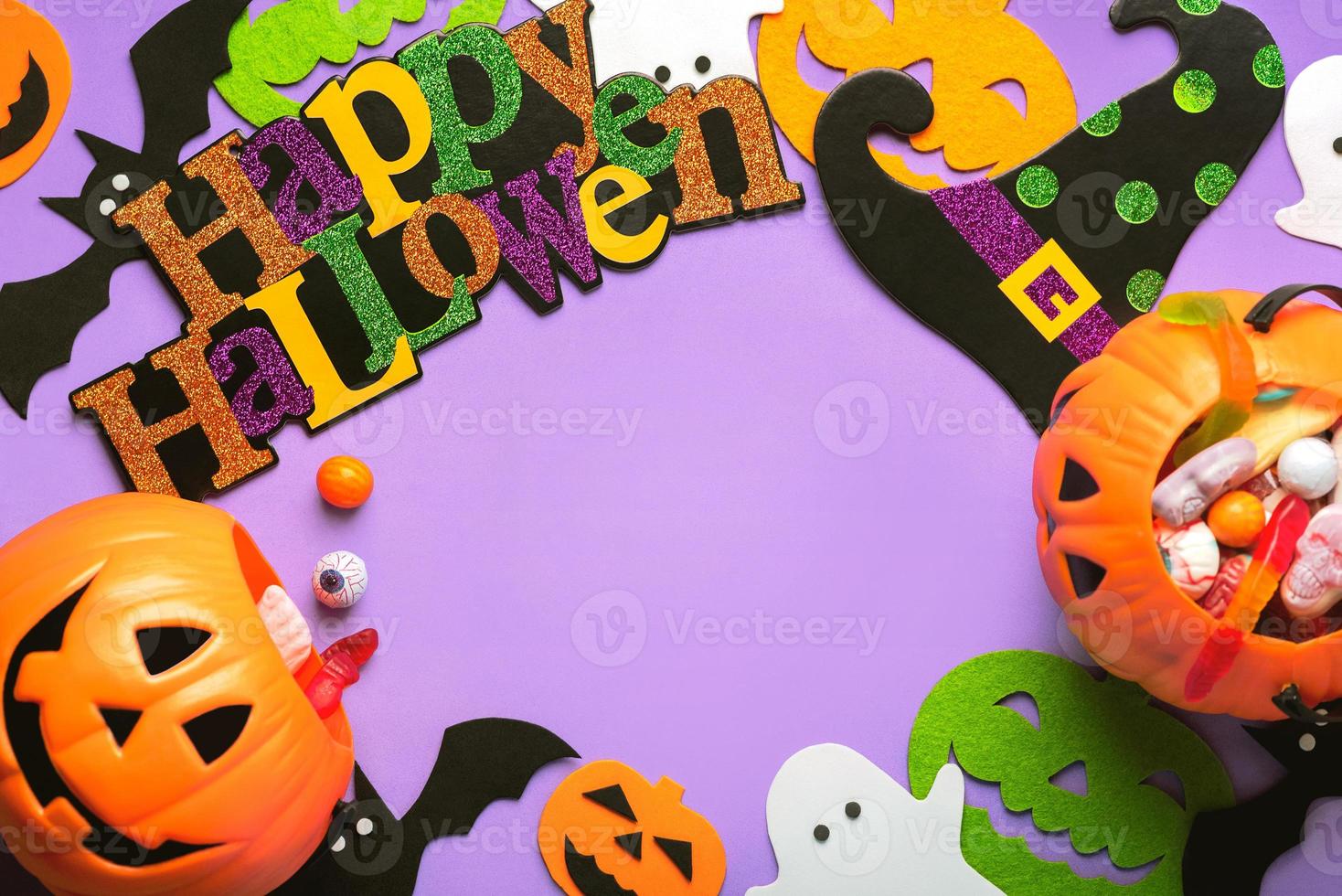 Happy Halloween. Top view of decoration Halloween party, ghosts, bats and pumpkins with copy space. Halloween concept background photo