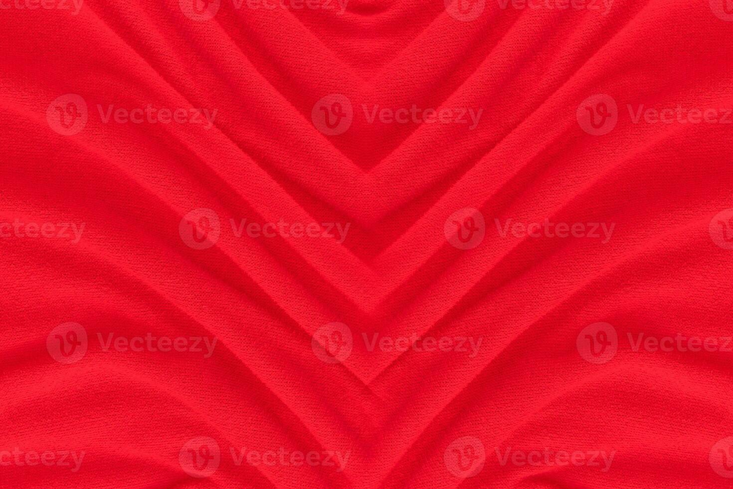 Red fabric texture background. Abstract cloth backdrop with soft waves. photo
