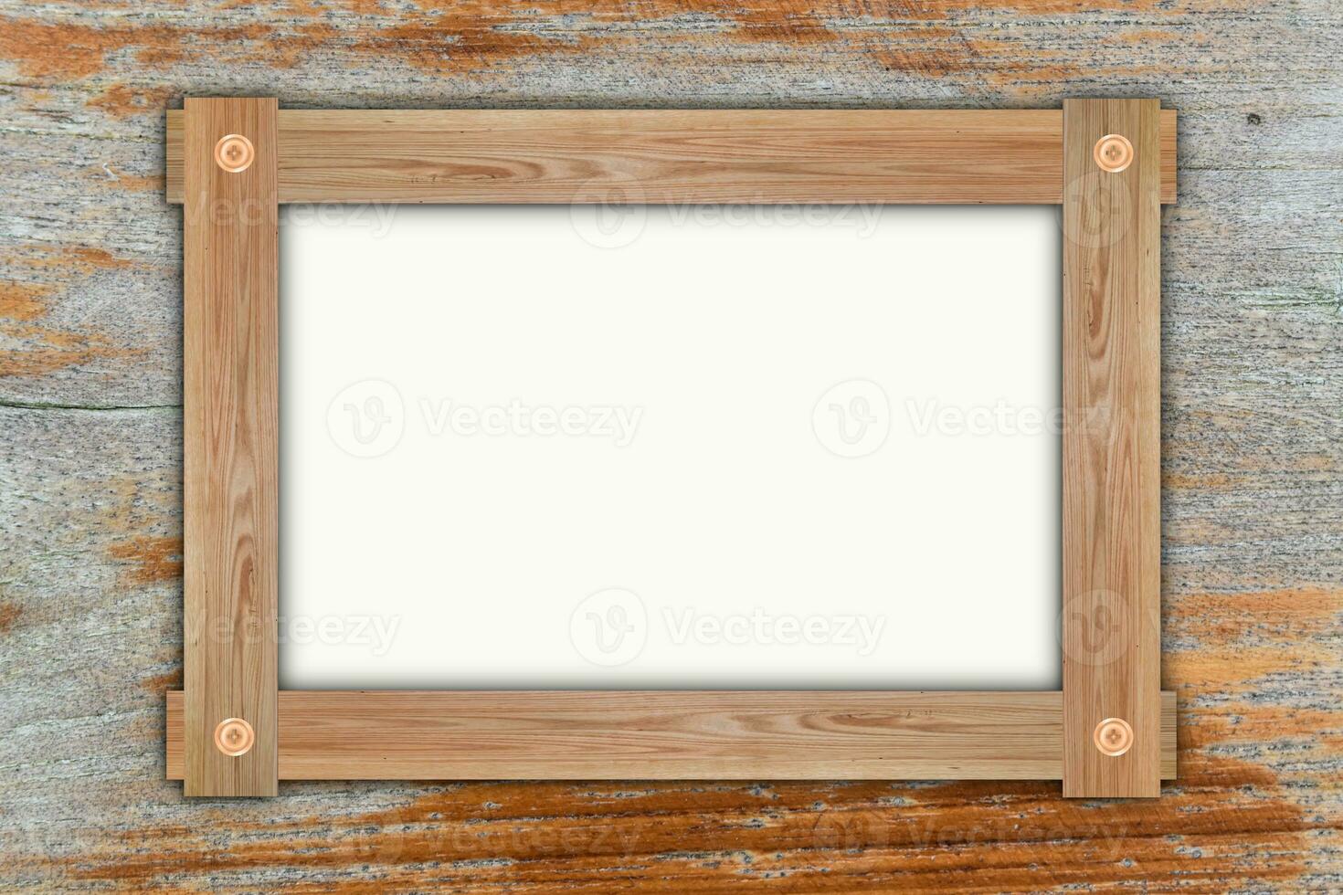 Empty wooden frame, hanging on wood panels background. Retro style design photo