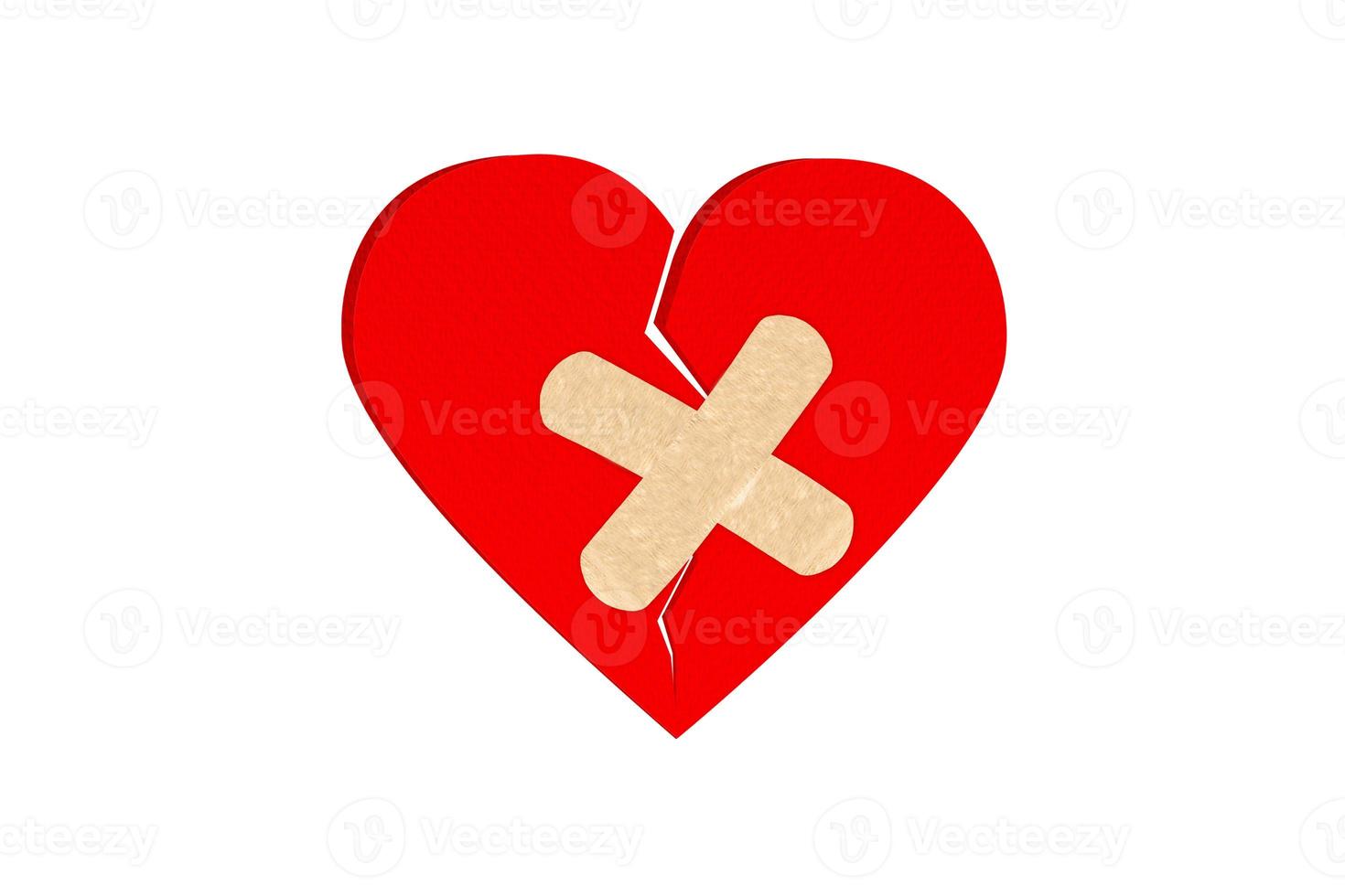 Broken heart with plaster isolated on white background. Object with clipping path. photo