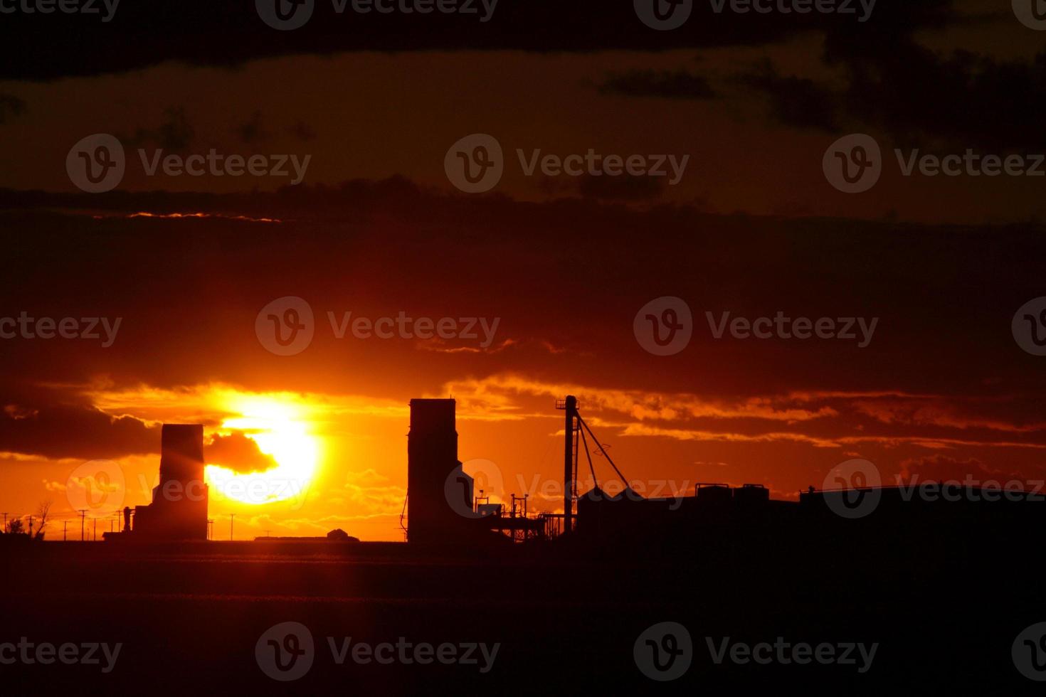 Sunset behind two Saskatchewan grain elevators photo