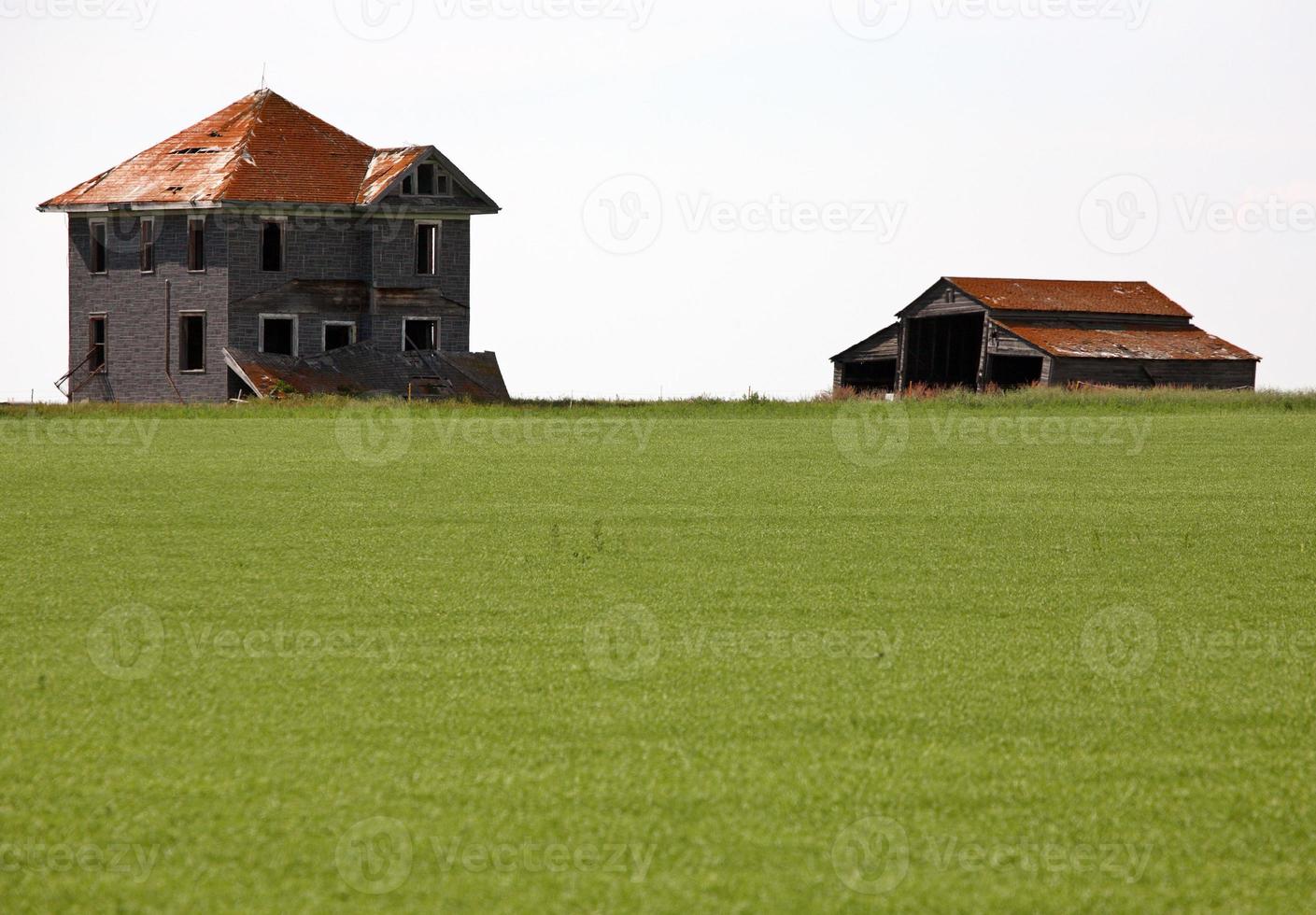 Weathered old farm house in scenic Saskatchewan photo