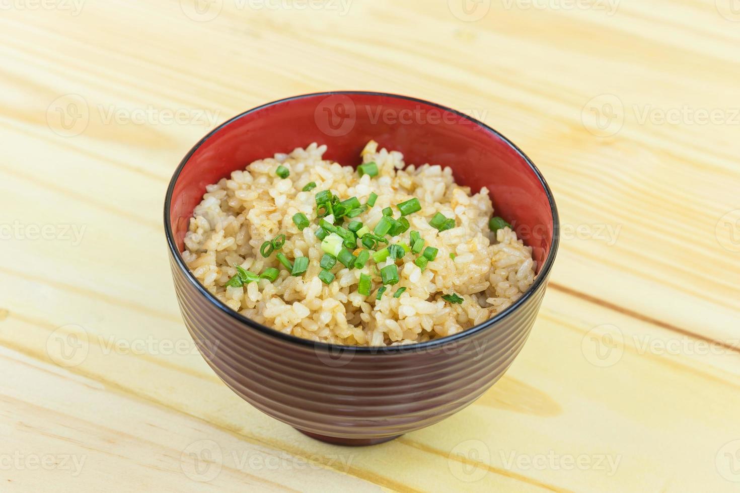 Thai garlic fried rice with vegetable on top photo