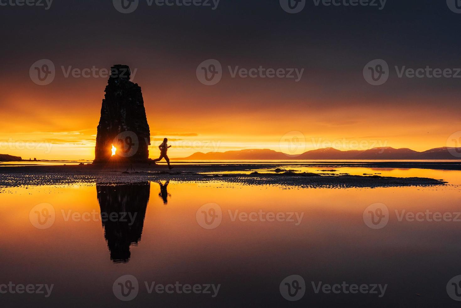 Hvitserkur 15 m height. Is a spectacular rock in the sea on the Northern coast of Iceland. On this photo Hvitserkur reflects in the sea water after the midnight sunset.