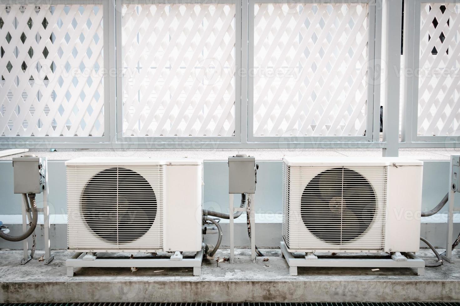 Cooling Air Condition Unit and Control System, Air Condenser Engine Station Outside Building of HVAC Systems. Electrical Compressor Fan Coil of Air Conditioning Equipment for Home Residential Units. photo