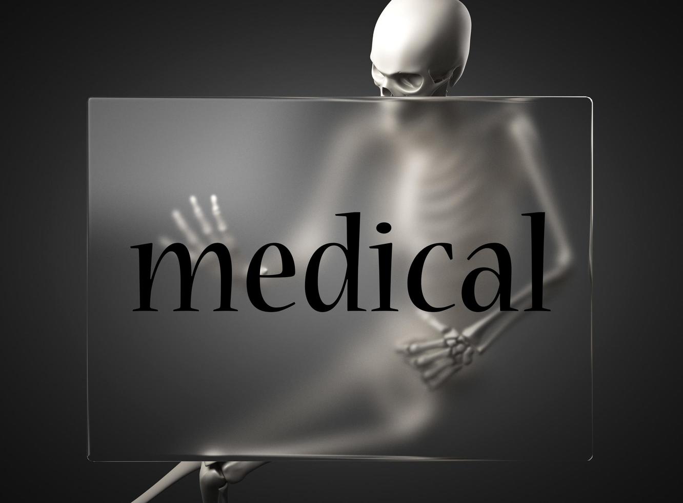 medical word on glass and skeleton photo