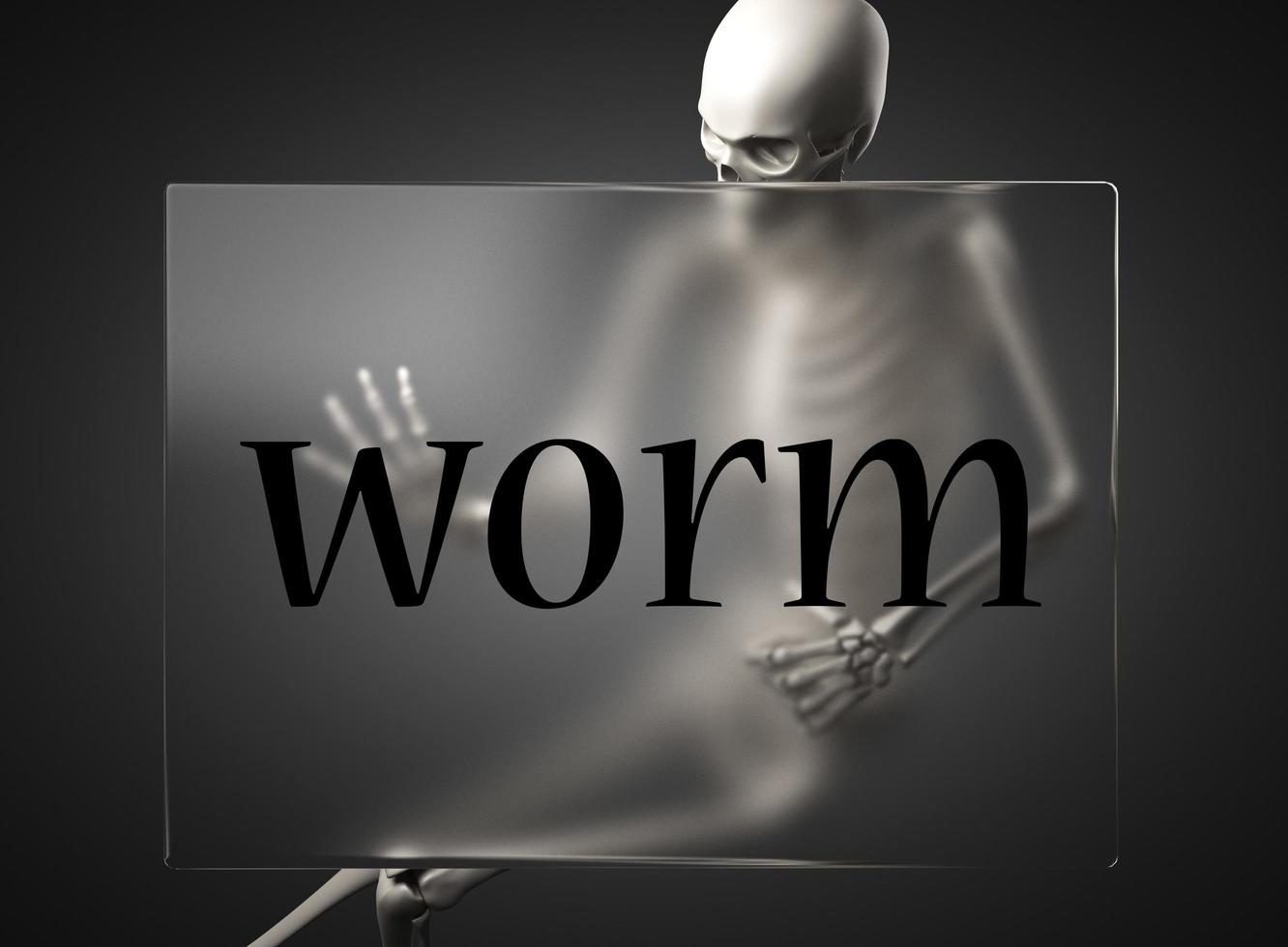 worm word on glass and skeleton photo