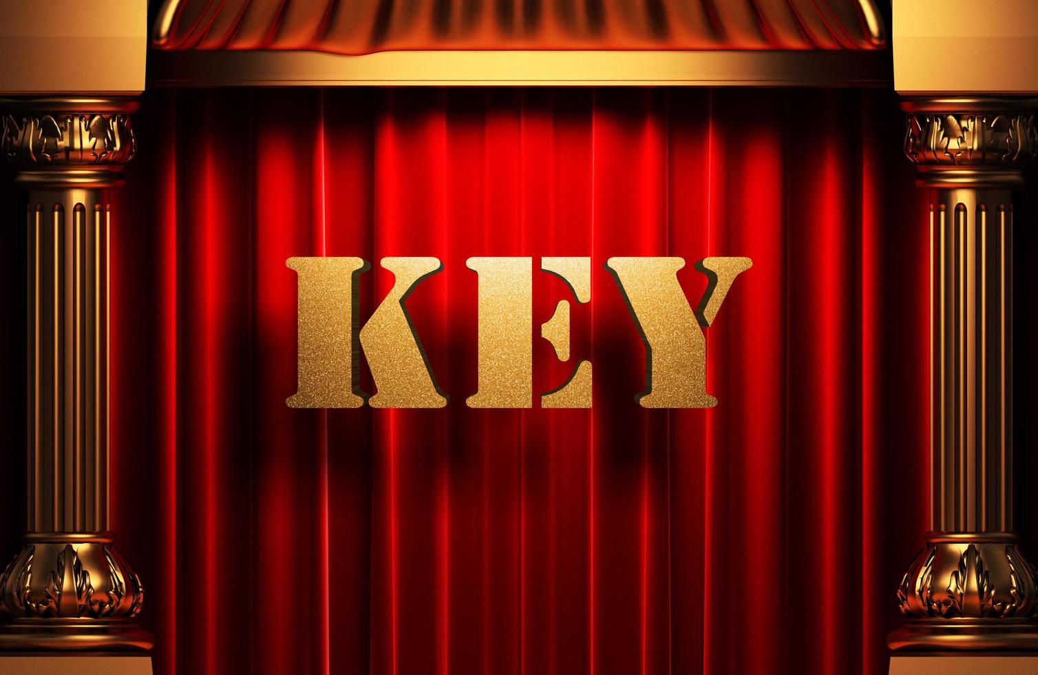 key golden word on red curtain photo