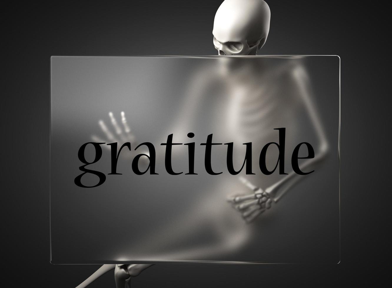 gratitude word on glass and skeleton photo