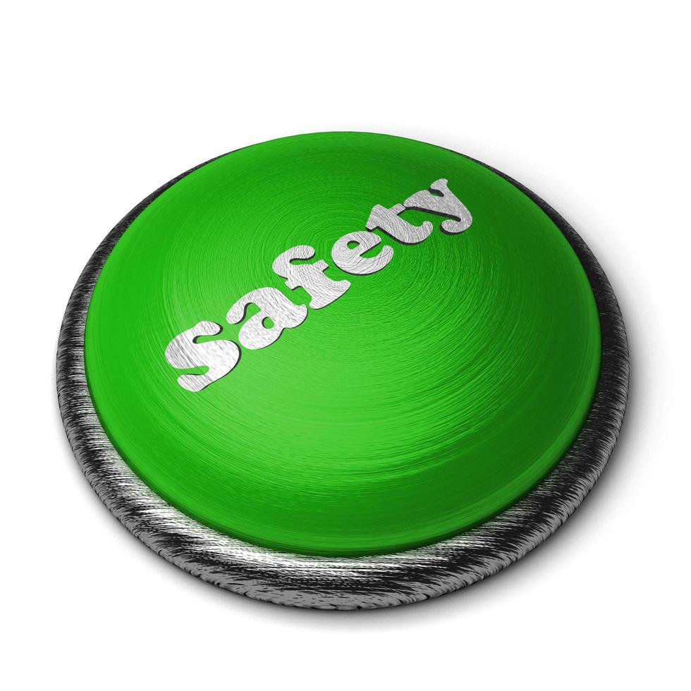 safety word on green button isolated on white photo