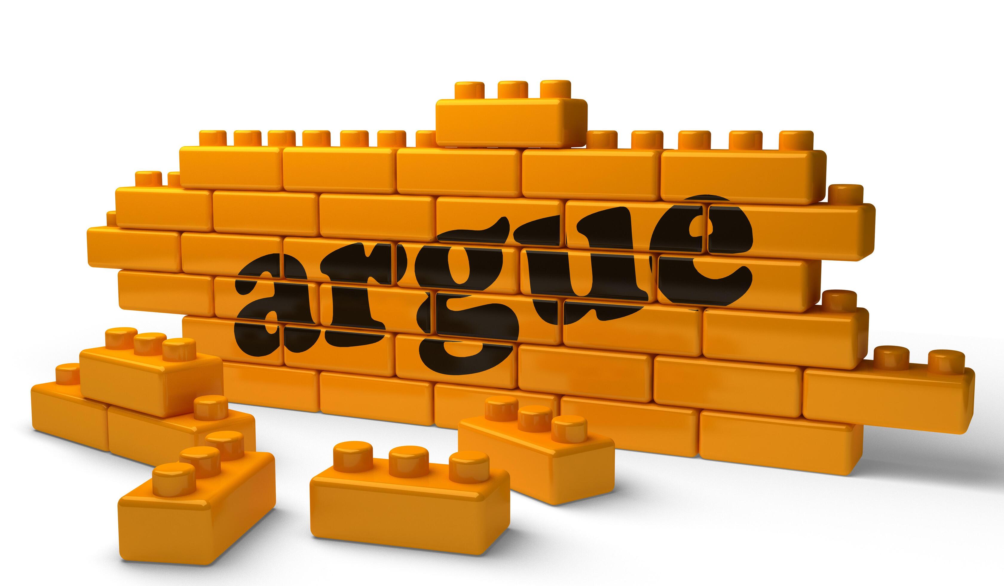 argue word on yellow brick wall 6293854 Stock Photo at Vecteezy