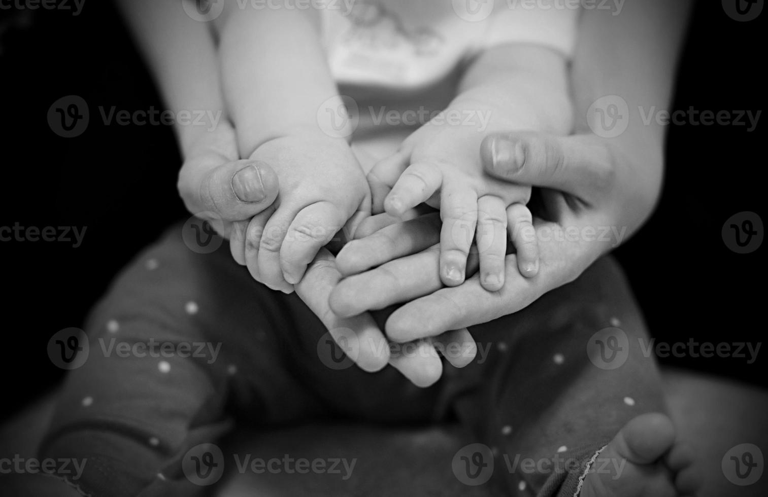 hands of incomplete family  father or mother and child. photo