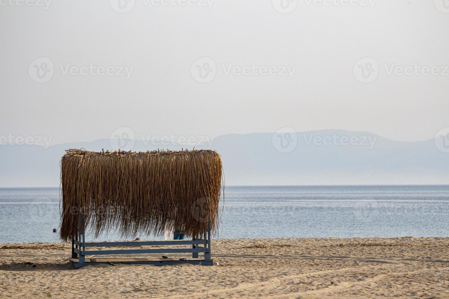 The cozy bungalow at the beach. Bungalow of bamboo. Sea background photo