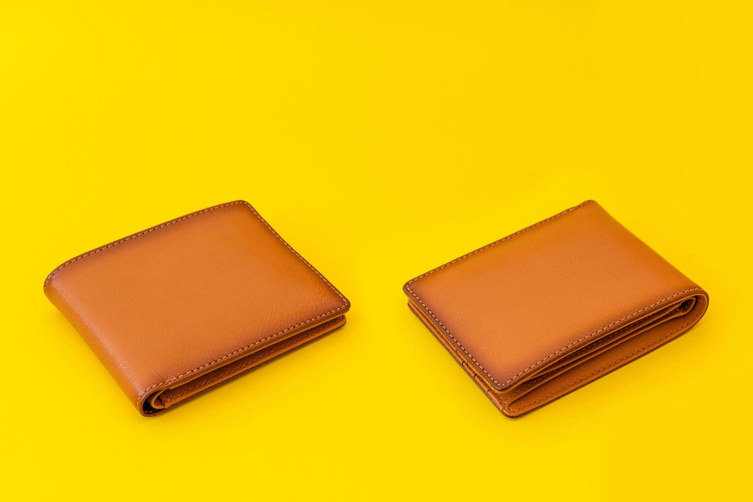 New leather brown men wallet on yellow photo