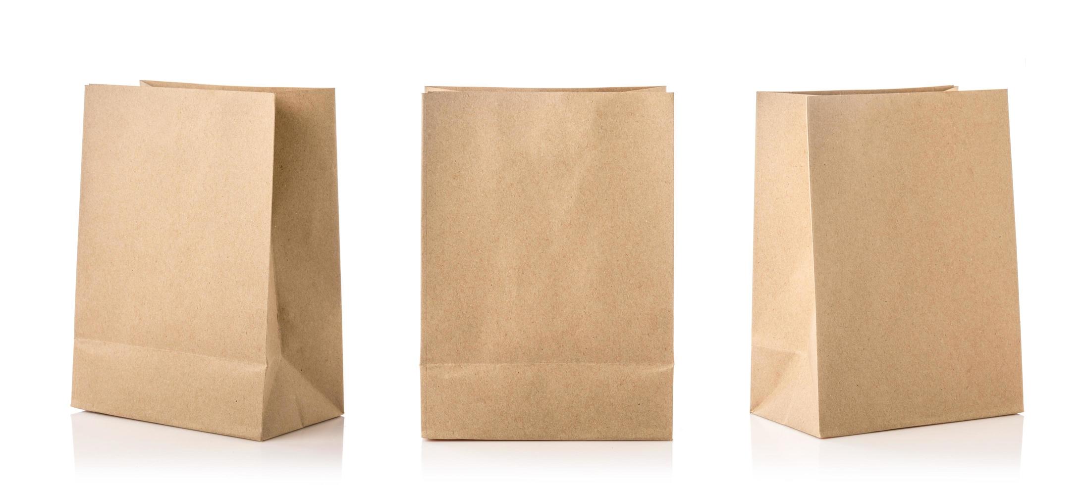 New blank brown paper bag for food packing. Studio shot isolated on white photo