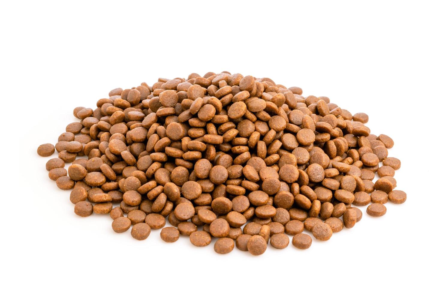 Pile of dog food isolated on white photo