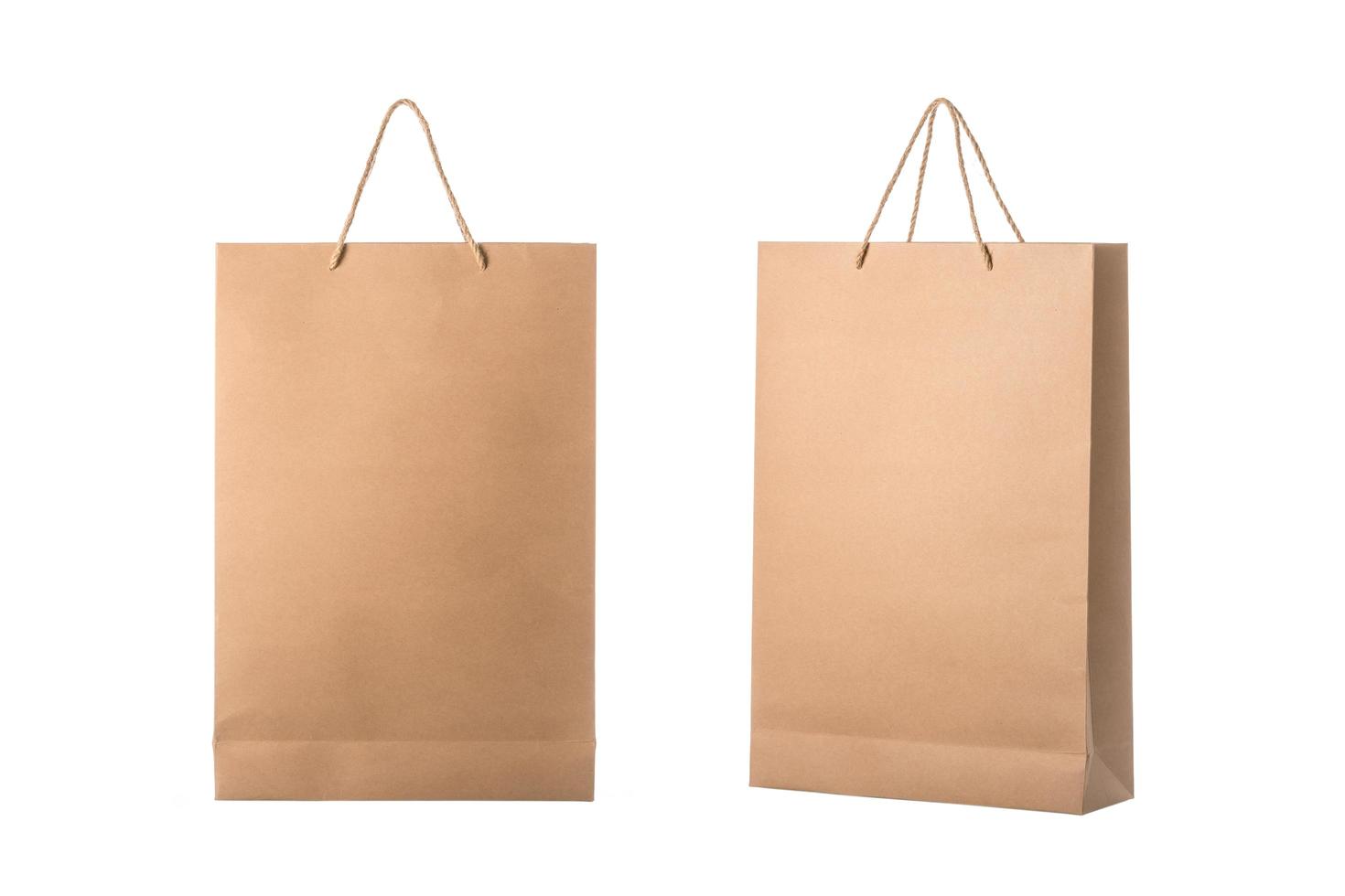 New blank brown paper bag for shopping. Studio shot isolated on white photo