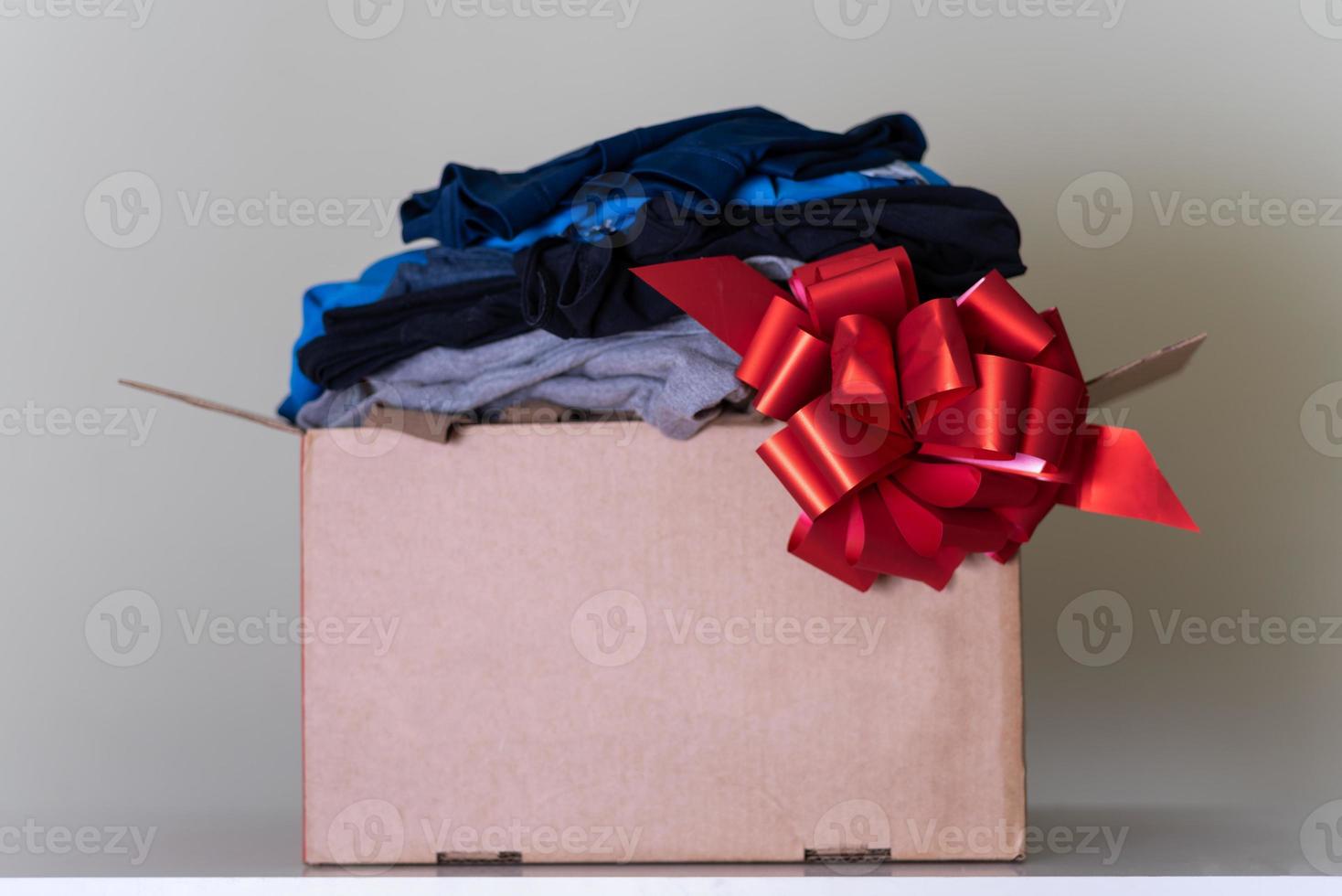 A large brown cardboard box filled with things. photo