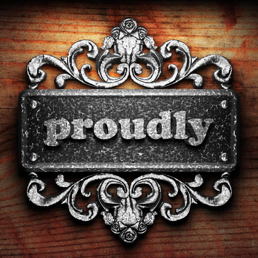 proudly word of iron on wooden background photo