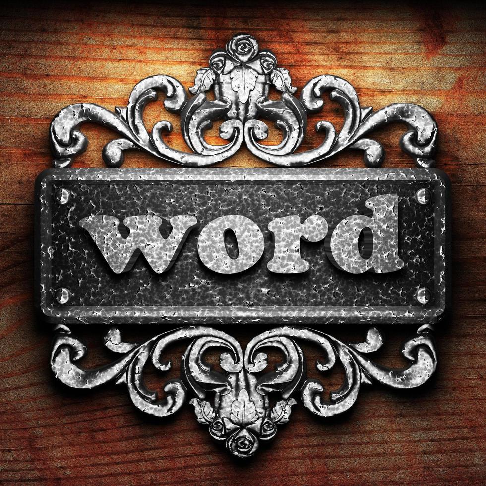 word word of iron on wooden background photo