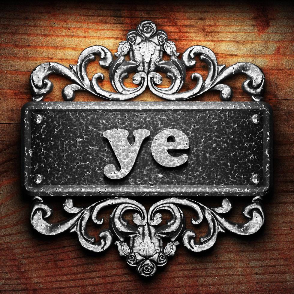 ye word of iron on wooden background photo