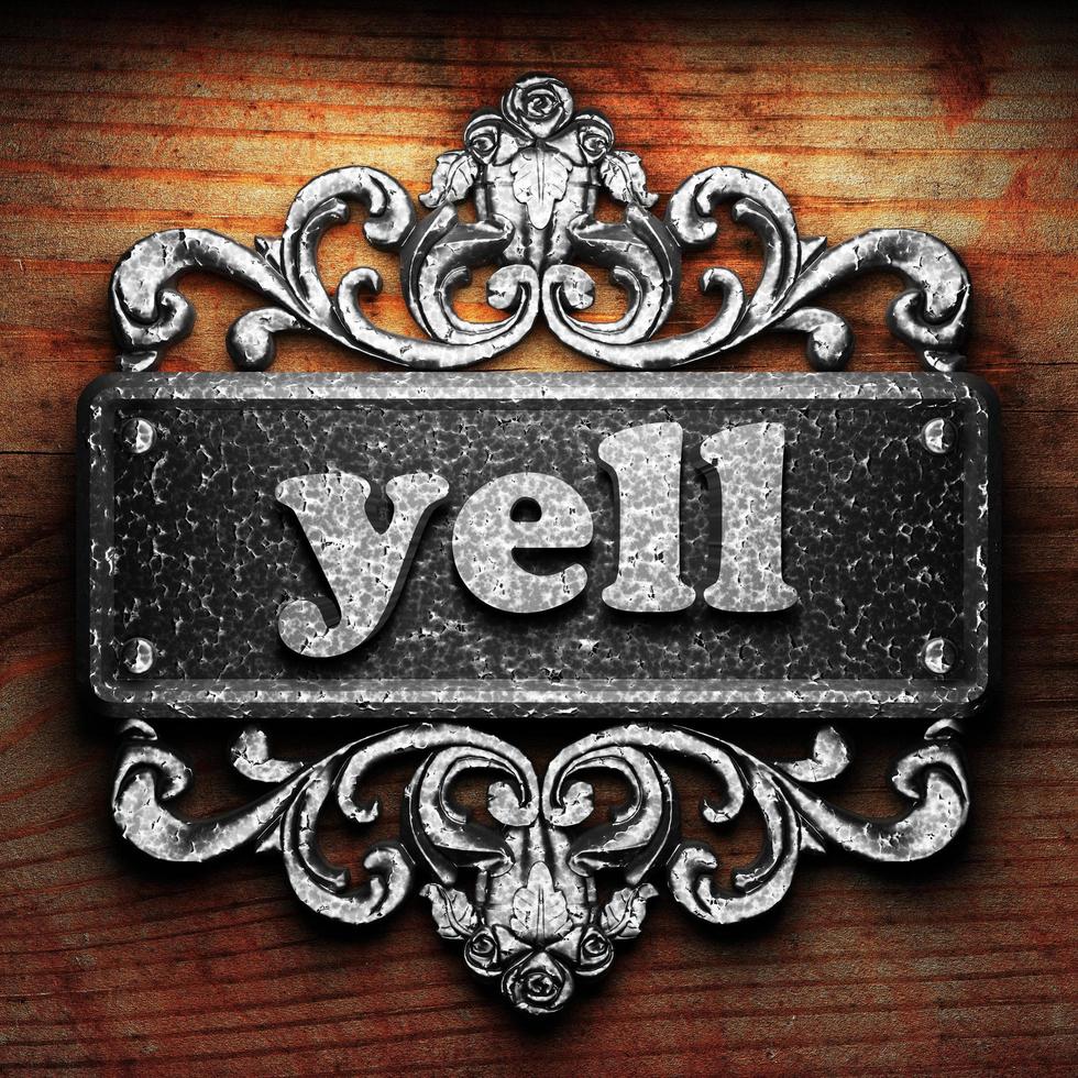 yell word of iron on wooden background photo