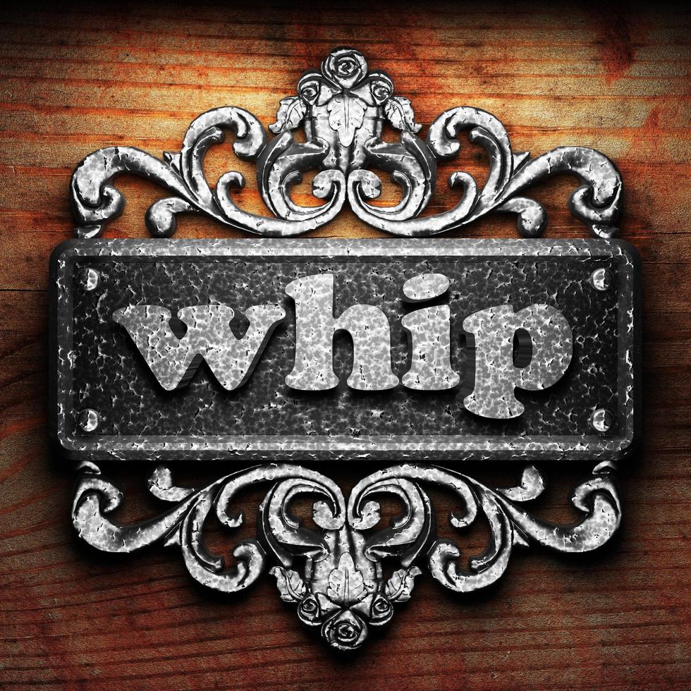 whip word of iron on wooden background photo