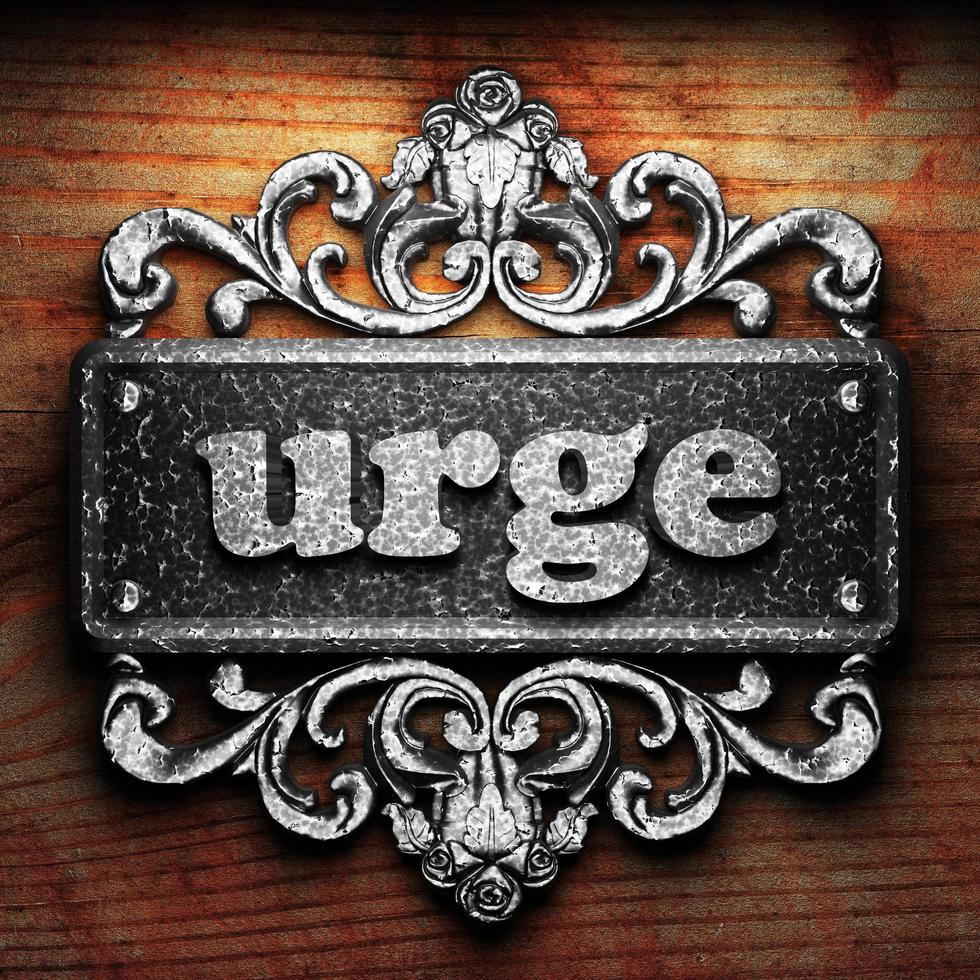 urge word of iron on wooden background photo