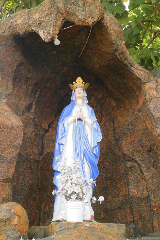 Editorial image of the statue of the Virgin Mary at the prayer place of Maria's Cave, Semarang, Indonesia photo
