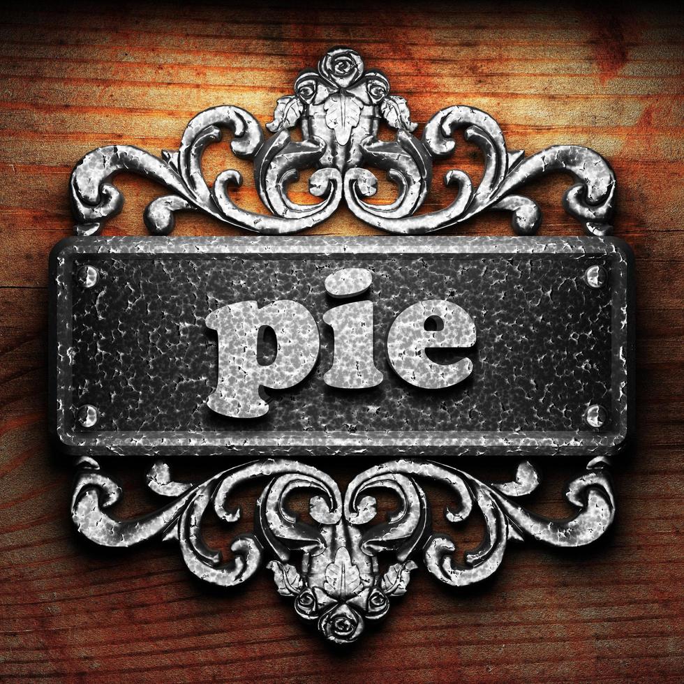 pie word of iron on wooden background photo