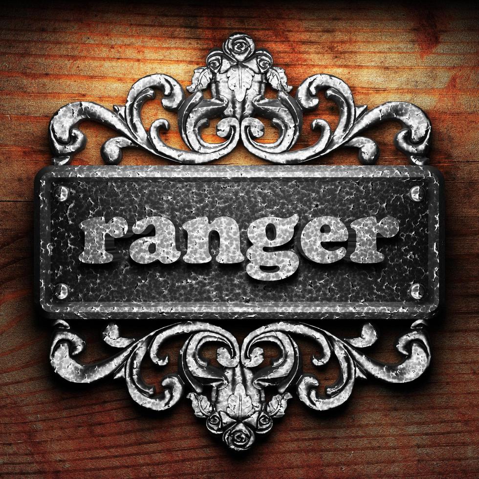 ranger word of iron on wooden background photo