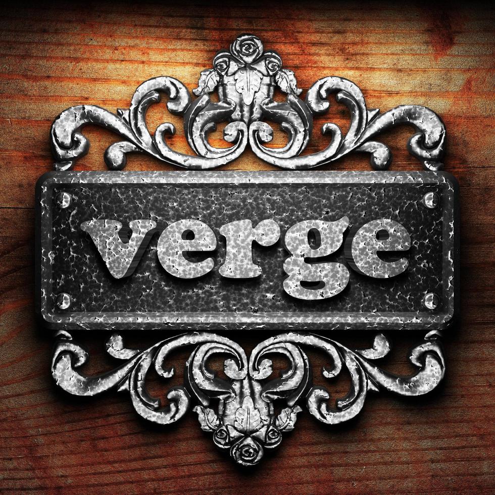 verge word of iron on wooden background photo