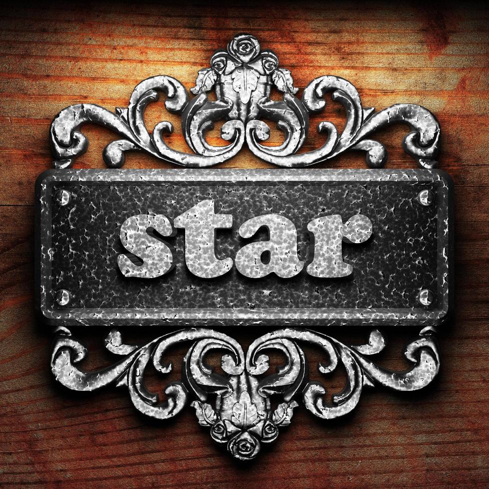 star word of iron on wooden background photo