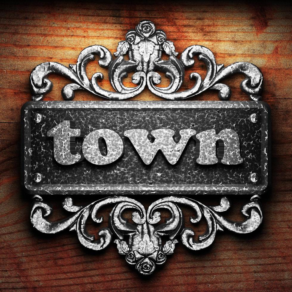 town word of iron on wooden background photo