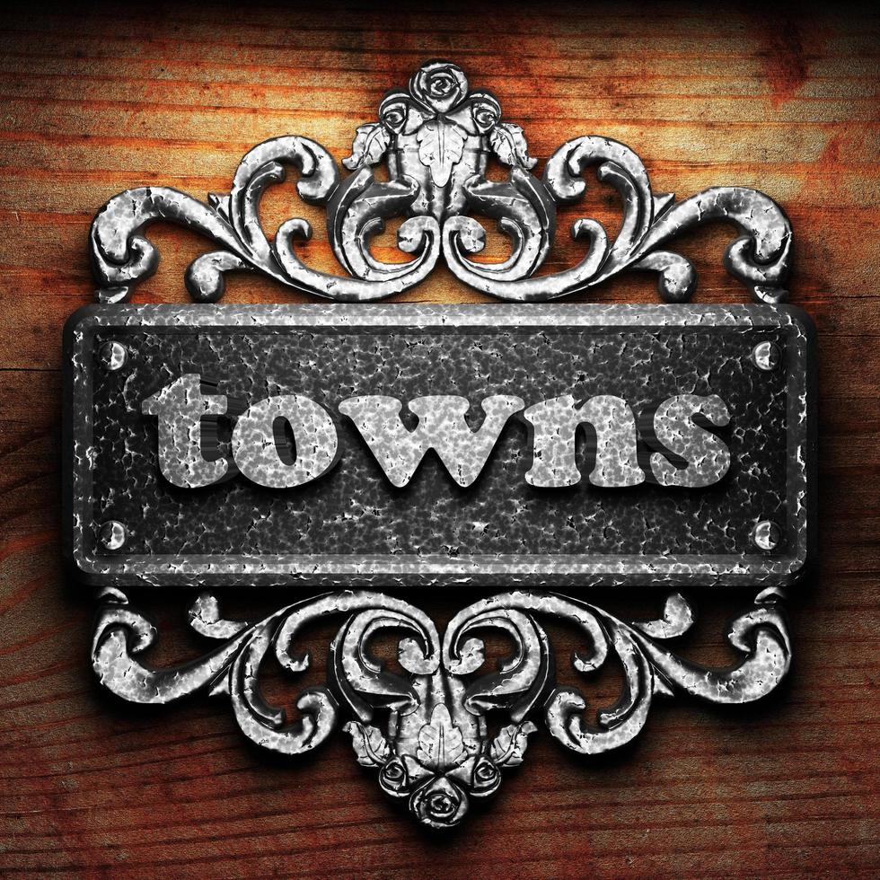 towns word of iron on wooden background photo