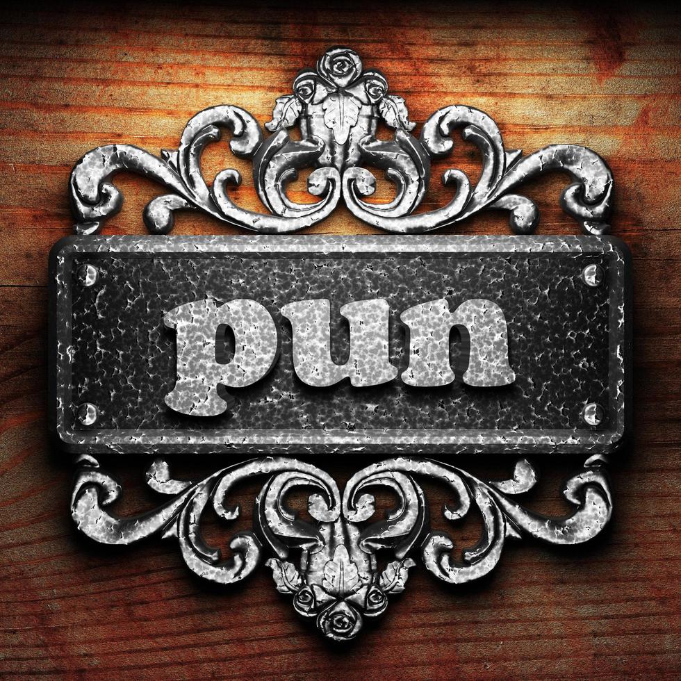 pun word of iron on wooden background photo