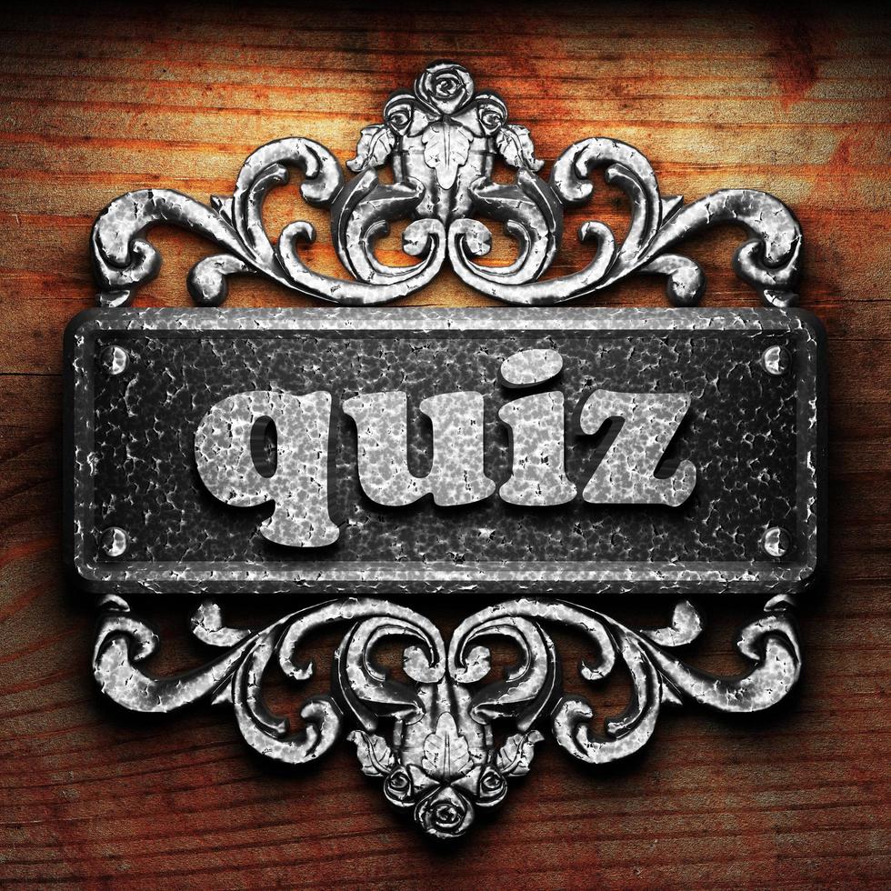 quiz word of iron on wooden background photo